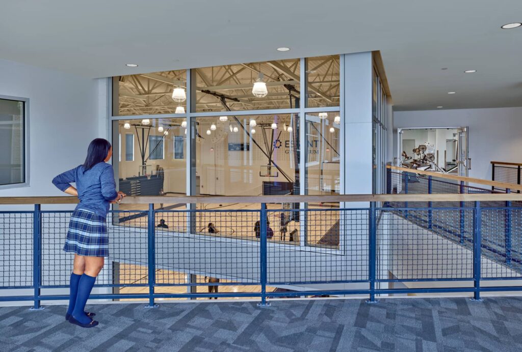 student at Cristo Rey looking over gymnasium